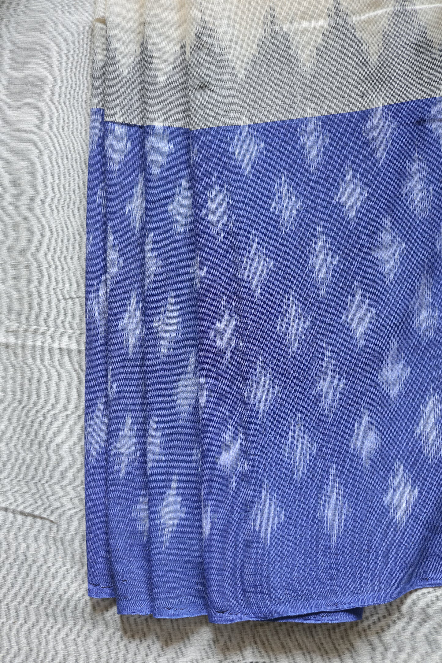 Off White Ikat Cotton with Big Blue Border Saree