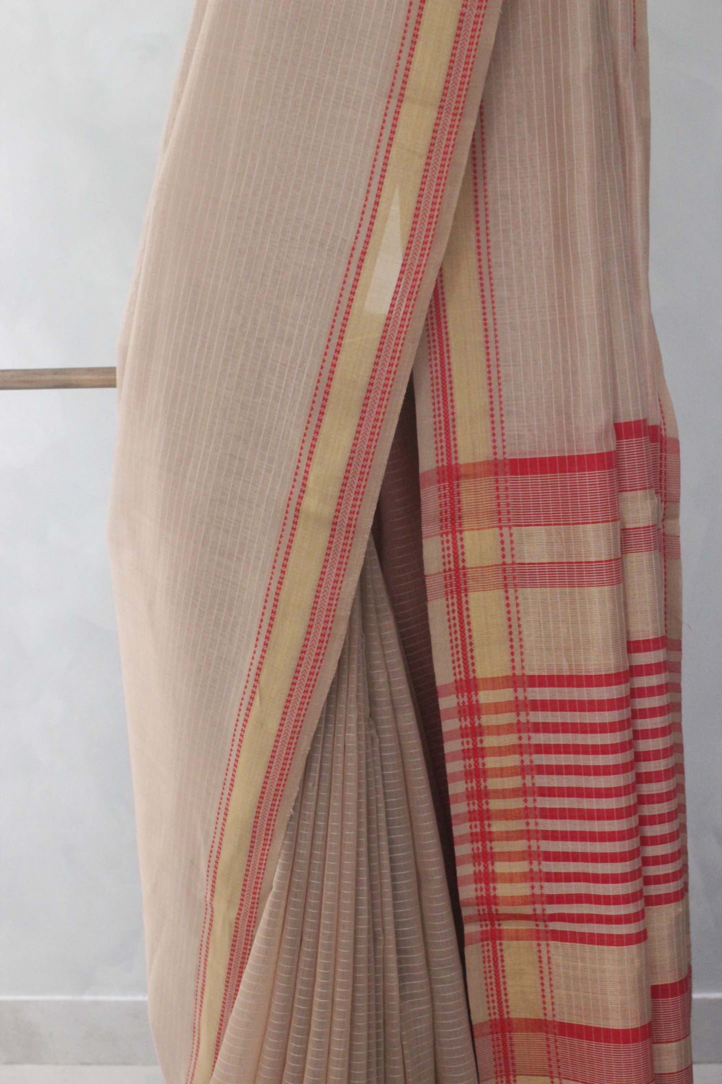 Light brown striped body with Multi colour border silk cotton saree