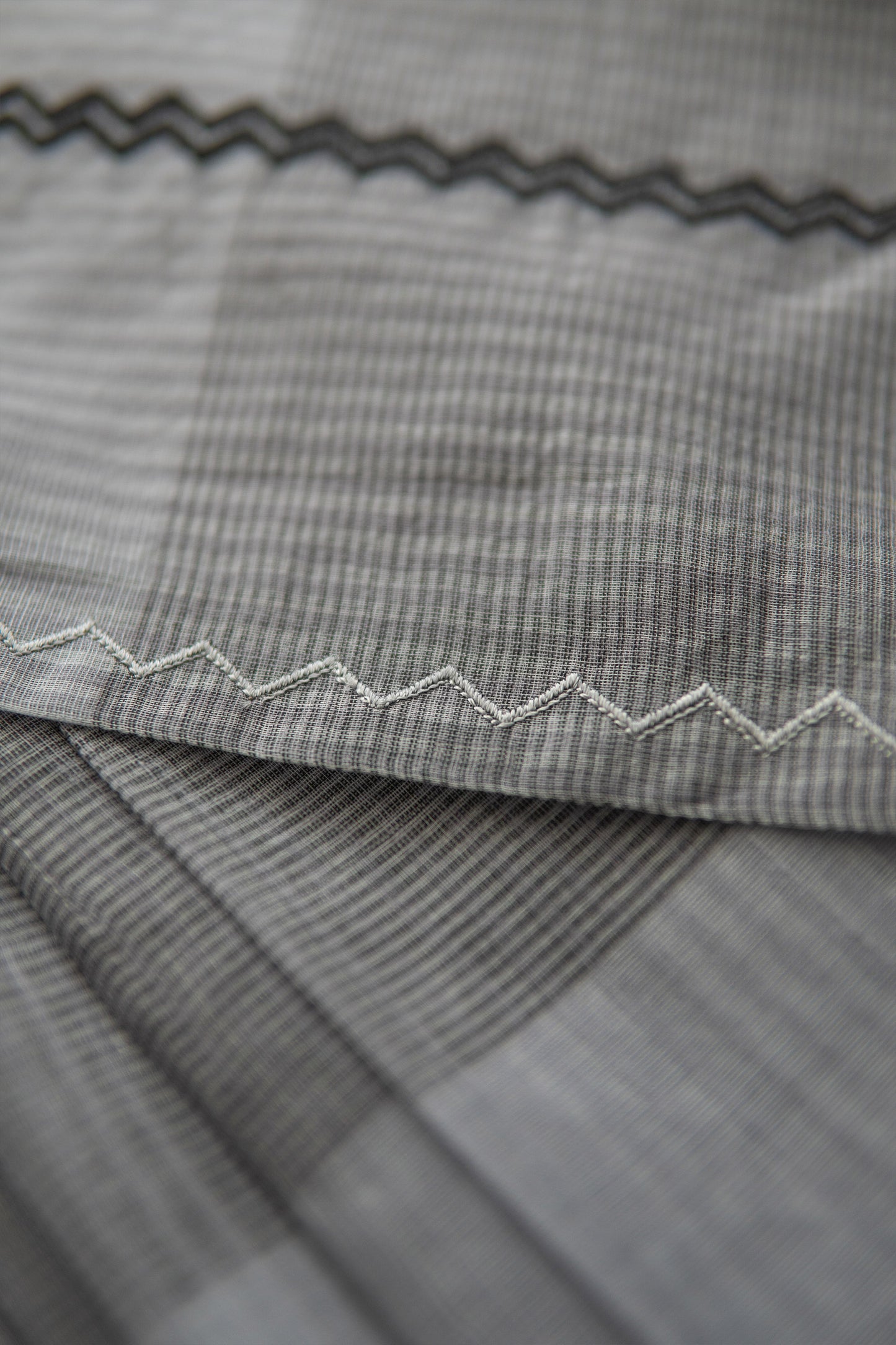 Dark Grey Silk Mercerised Cotton with Multi Checked Body and Zig Zag Border Saree