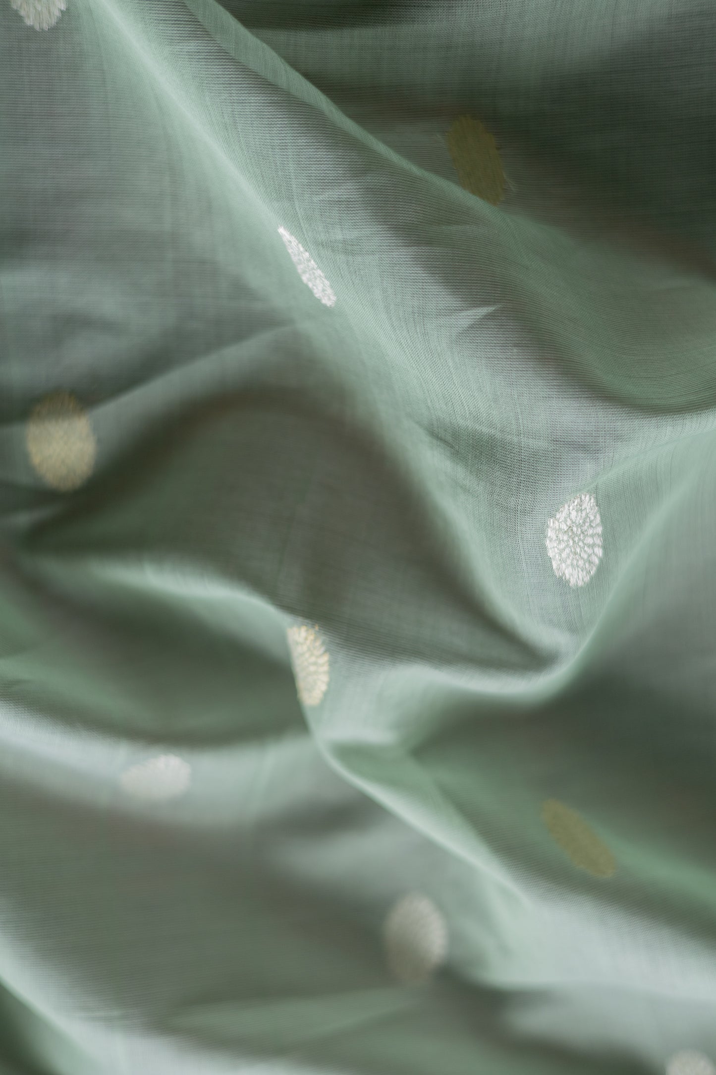 Algae Green Silk Cotton All Over Oval Woven Motif Saree