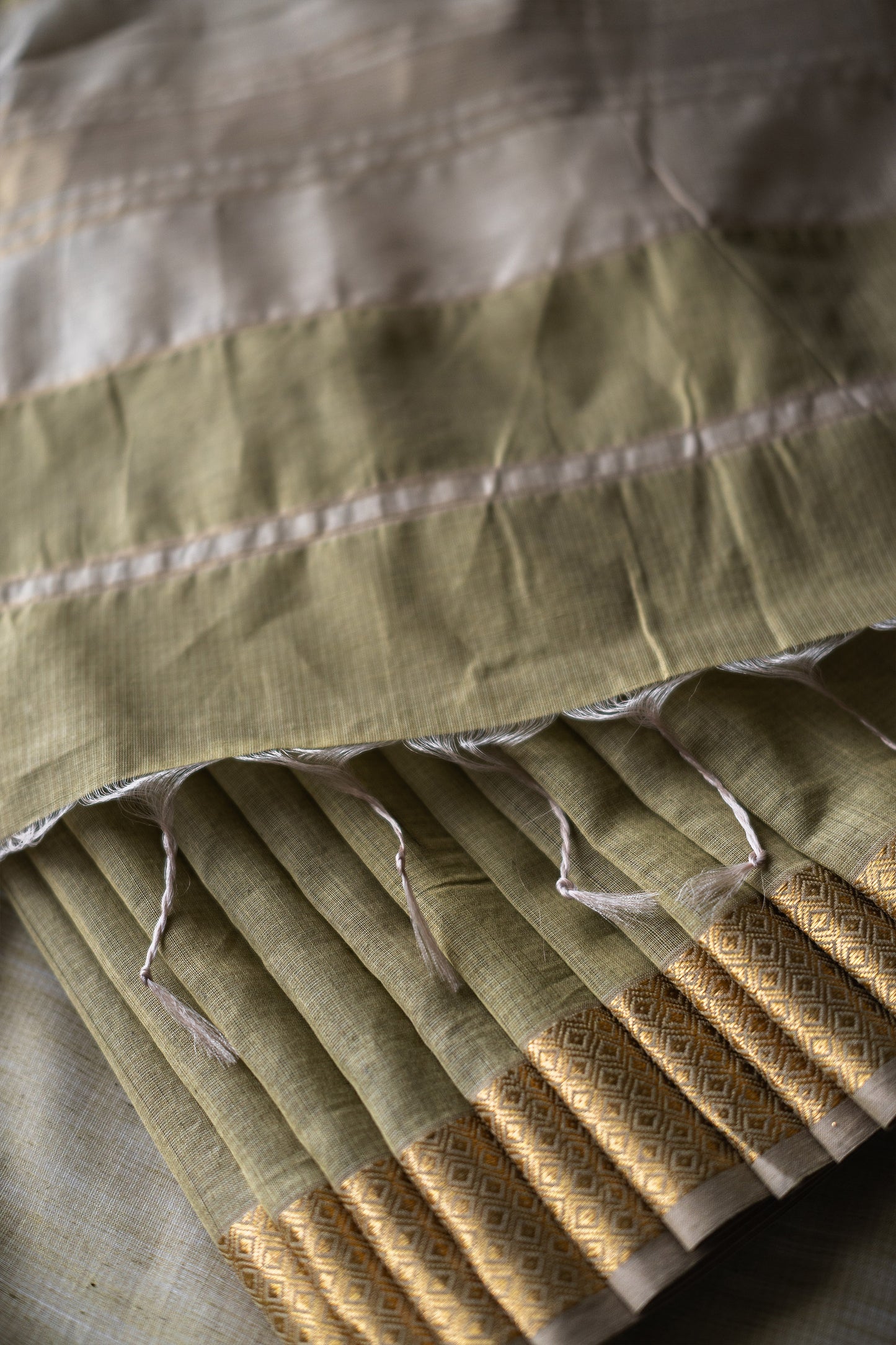 Olive Green silk khadi saree with self stripes & Zari border Saree