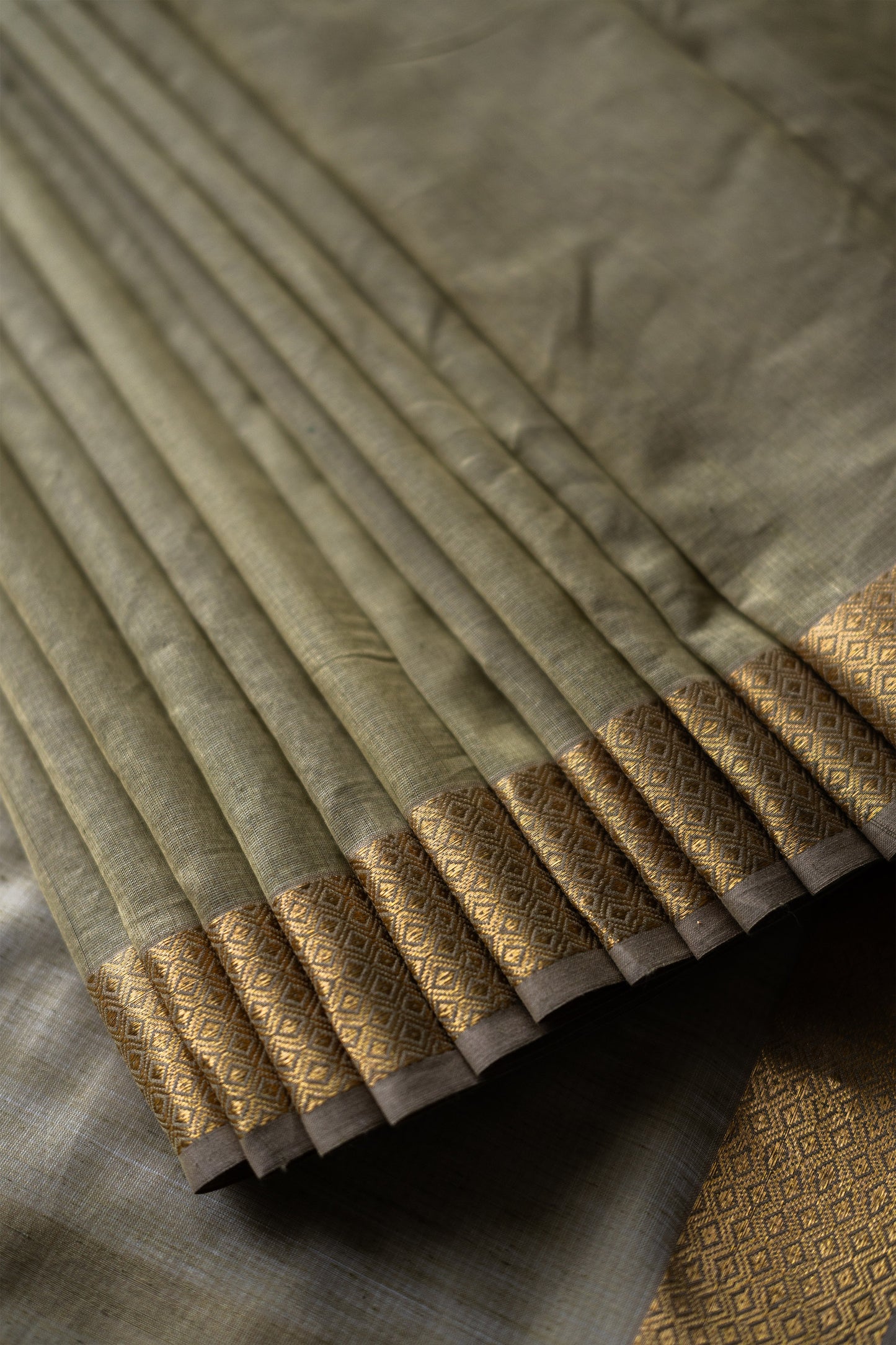 Olive Green silk khadi saree with self stripes & Zari border Saree