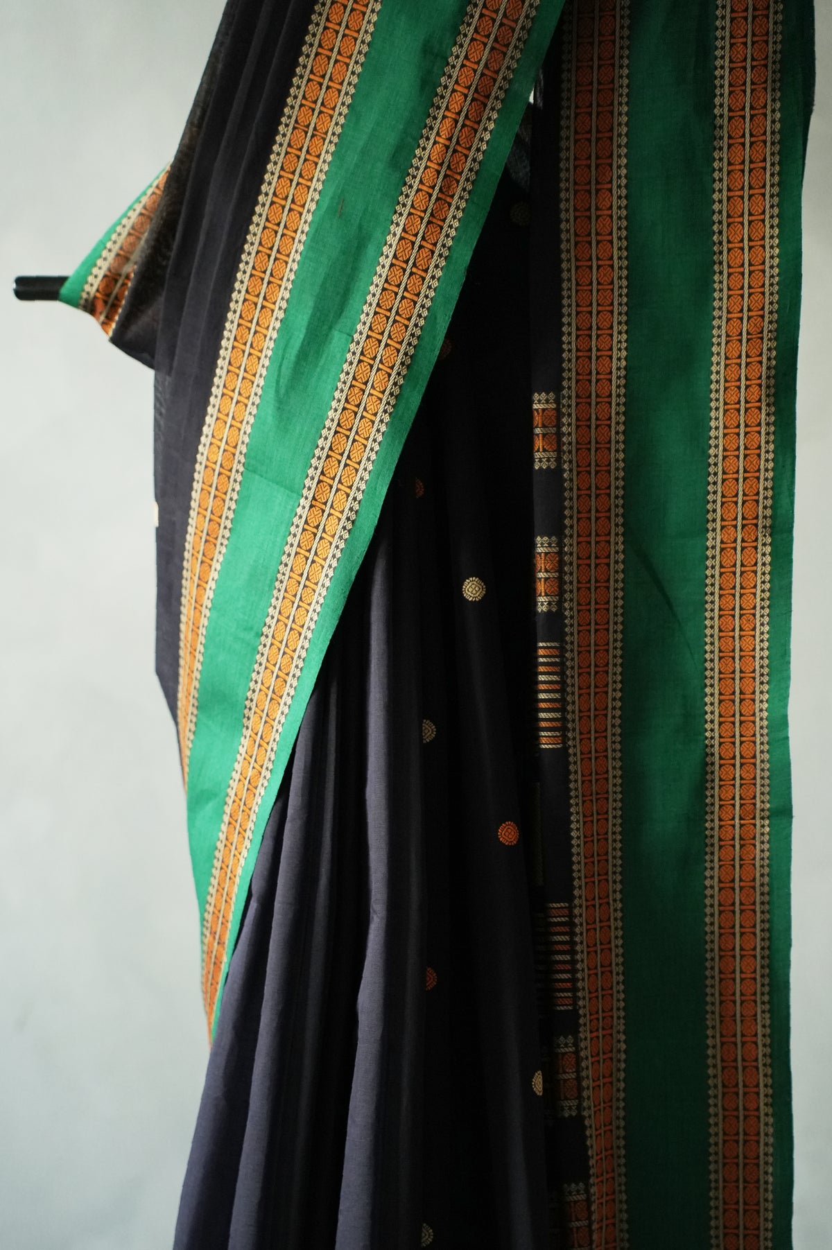 Jet Black Kanchi Cotton with Viridian Green and Orange Border Saree