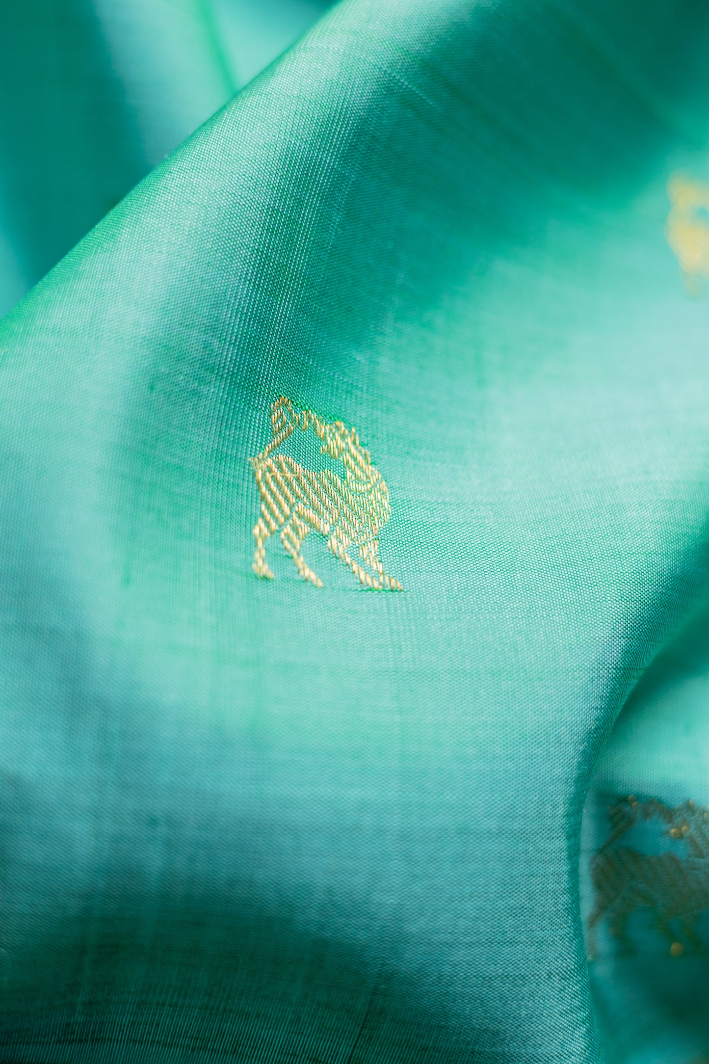 Teal Kanjivaram Silk with Intricately Woven Yazhi Motifs Saree