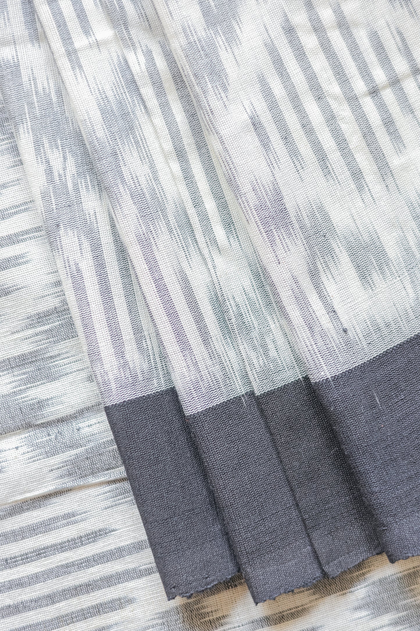 Off White Ikat Cotton with Small Black Border Saree