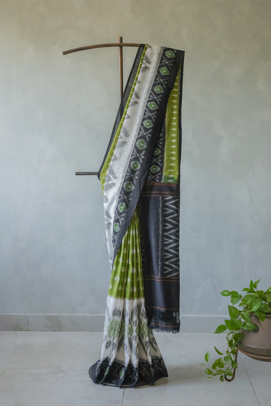 Off White and Green Ikat Cotton with Black Border Saree
