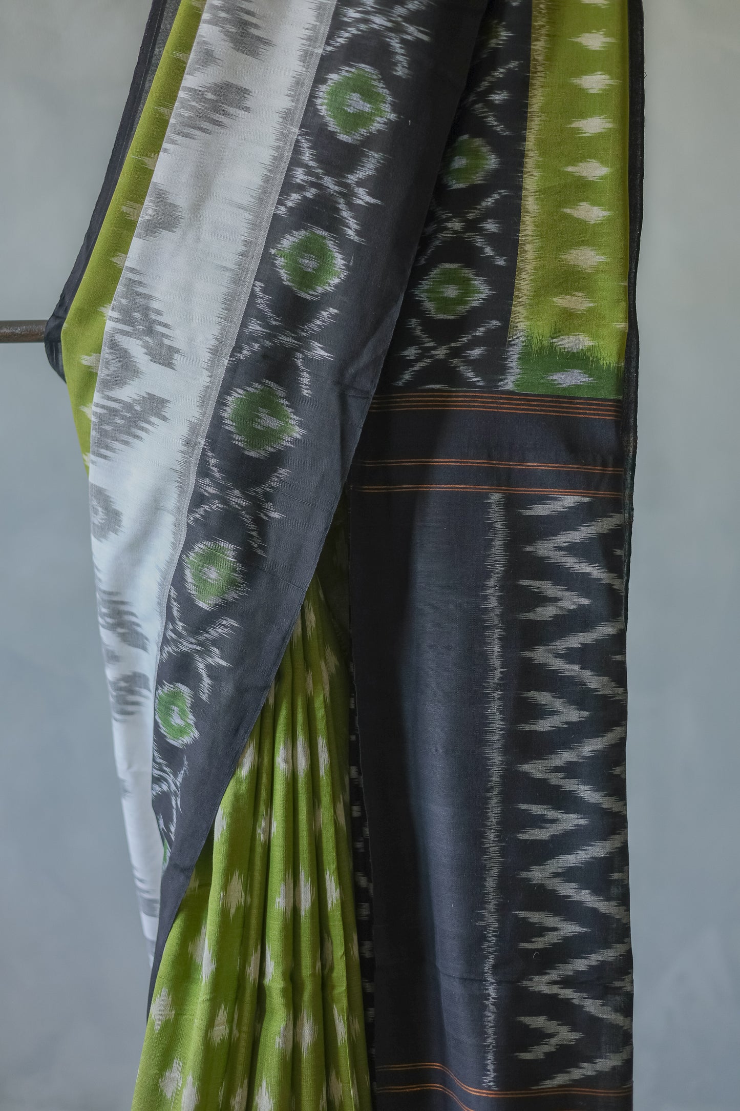 Off White and Green Ikat Cotton with Black Border Saree