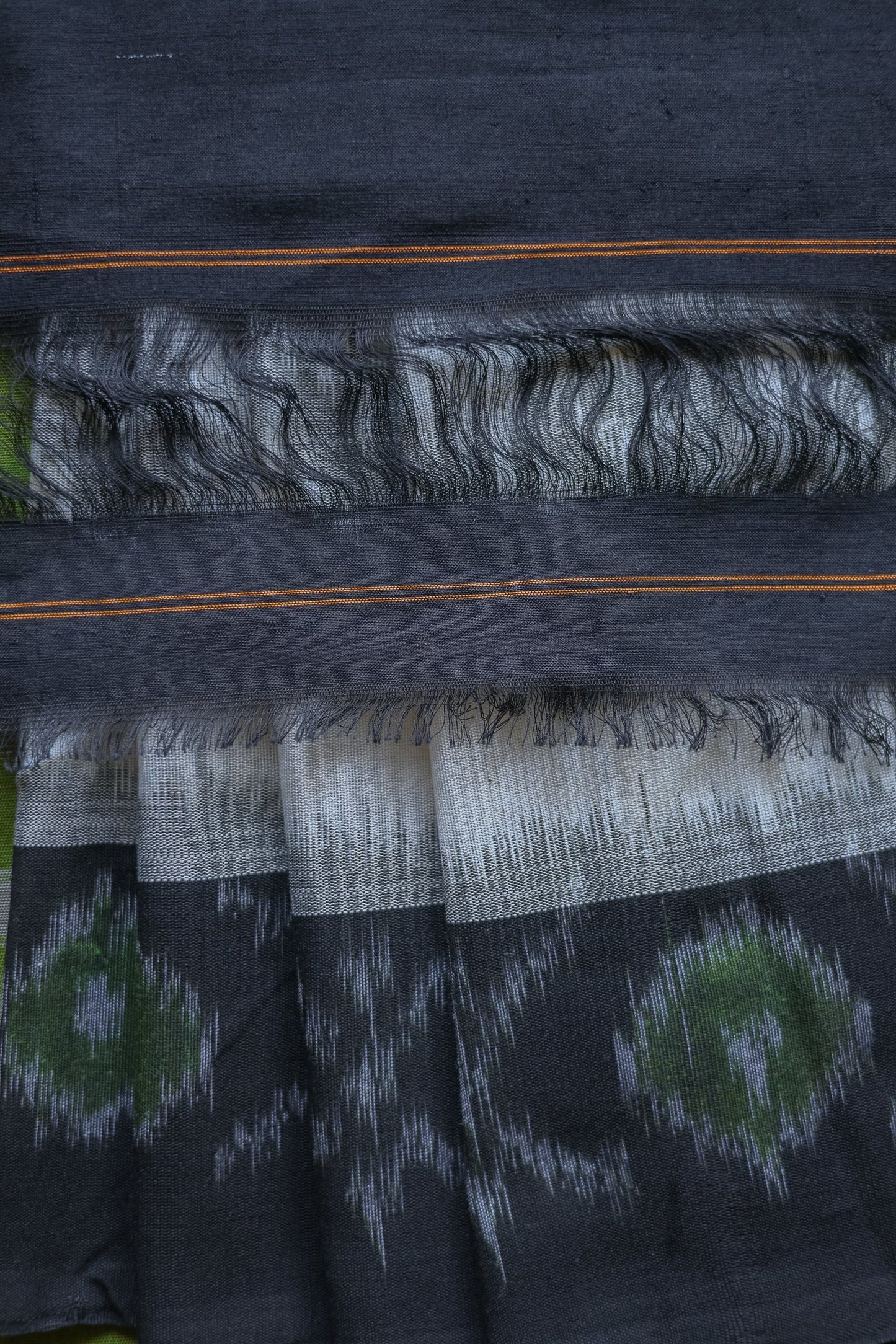 Off White and Green Ikat Cotton with Black Border Saree