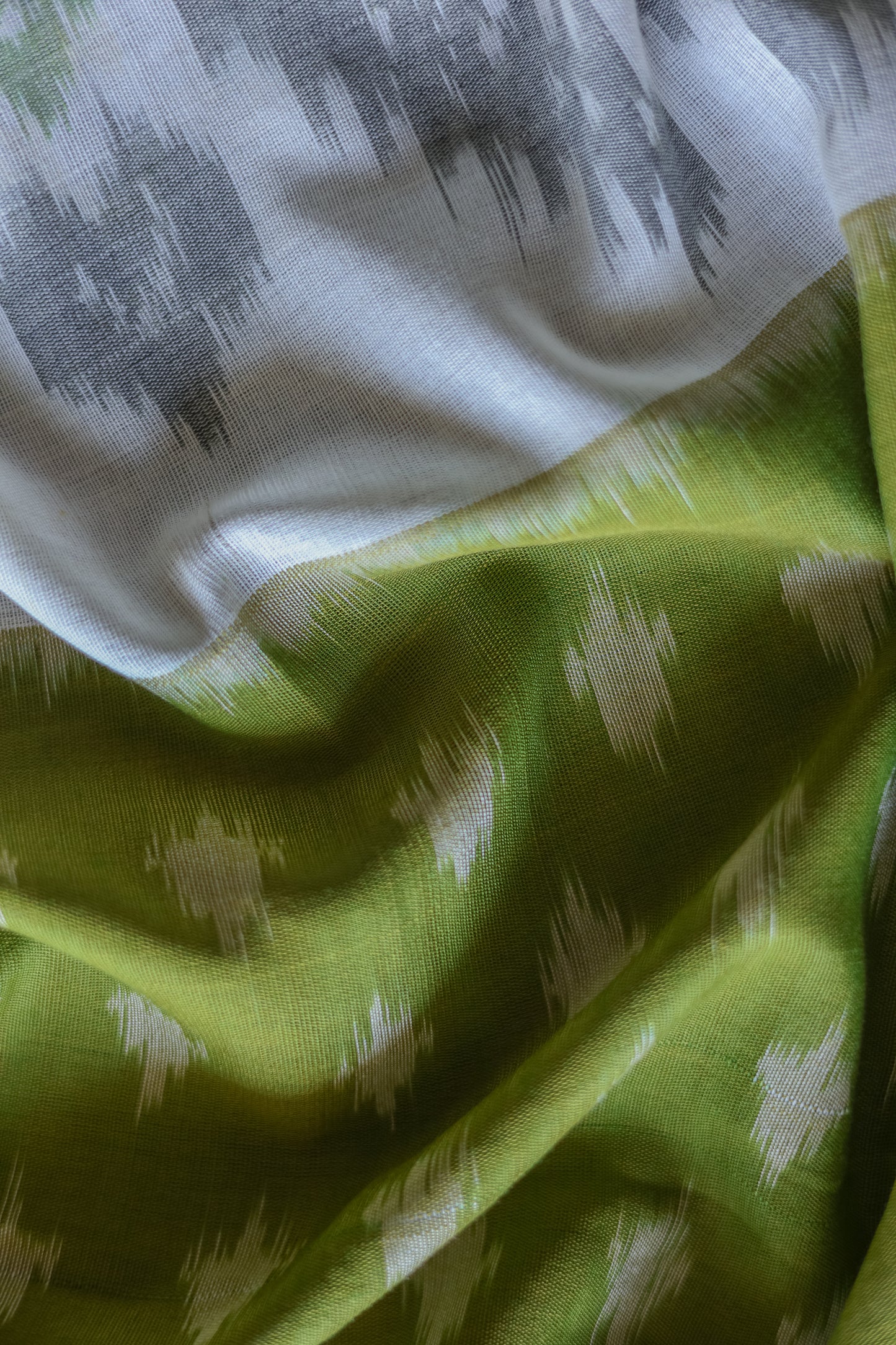 Off White and Green Ikat Cotton with Black Border Saree