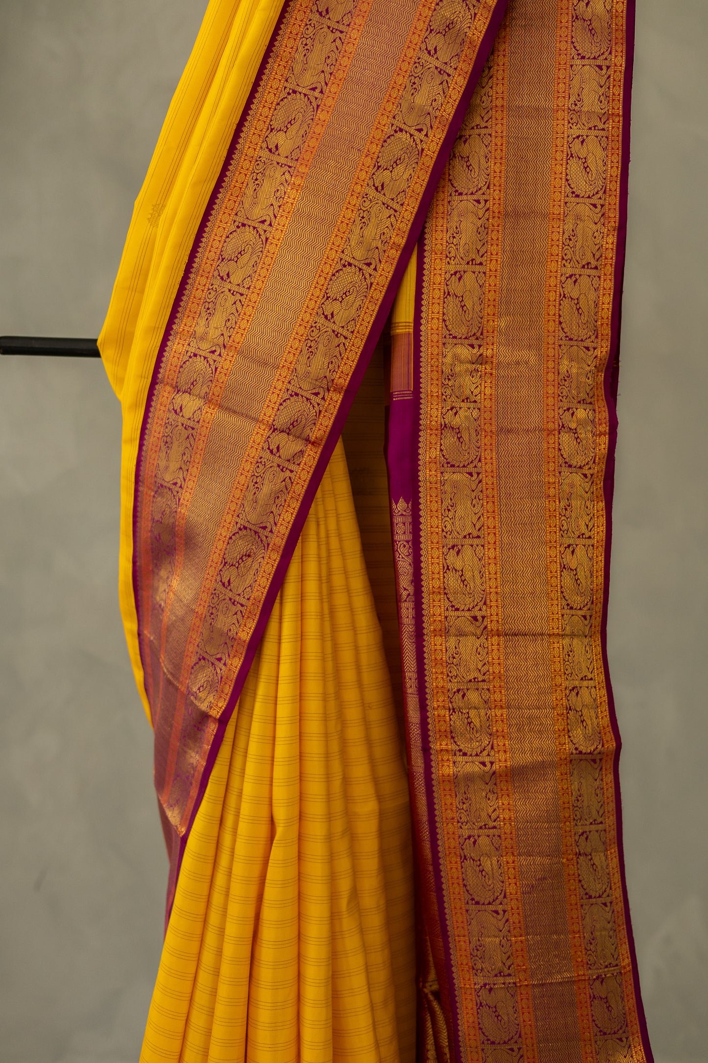 Yellow with Purple Yazhi and Peacock Motif Border Kanjivaram Silk Saree