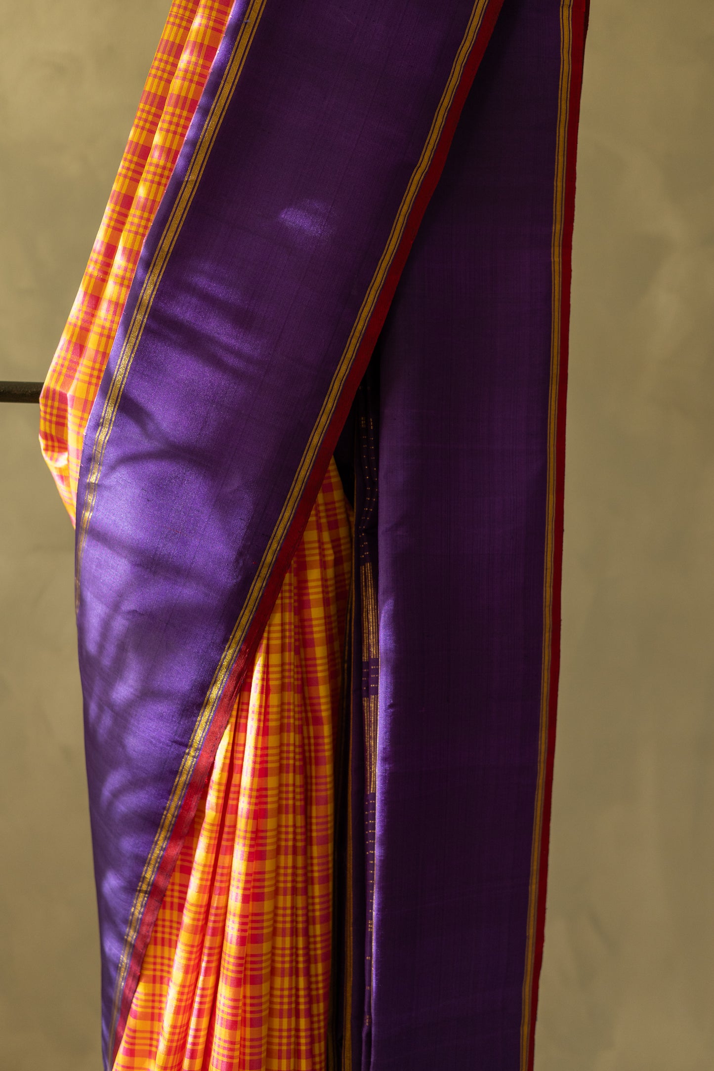 Orange with Pink Checks Kanjivaram Silk Accented by a Purple Pallu Saree