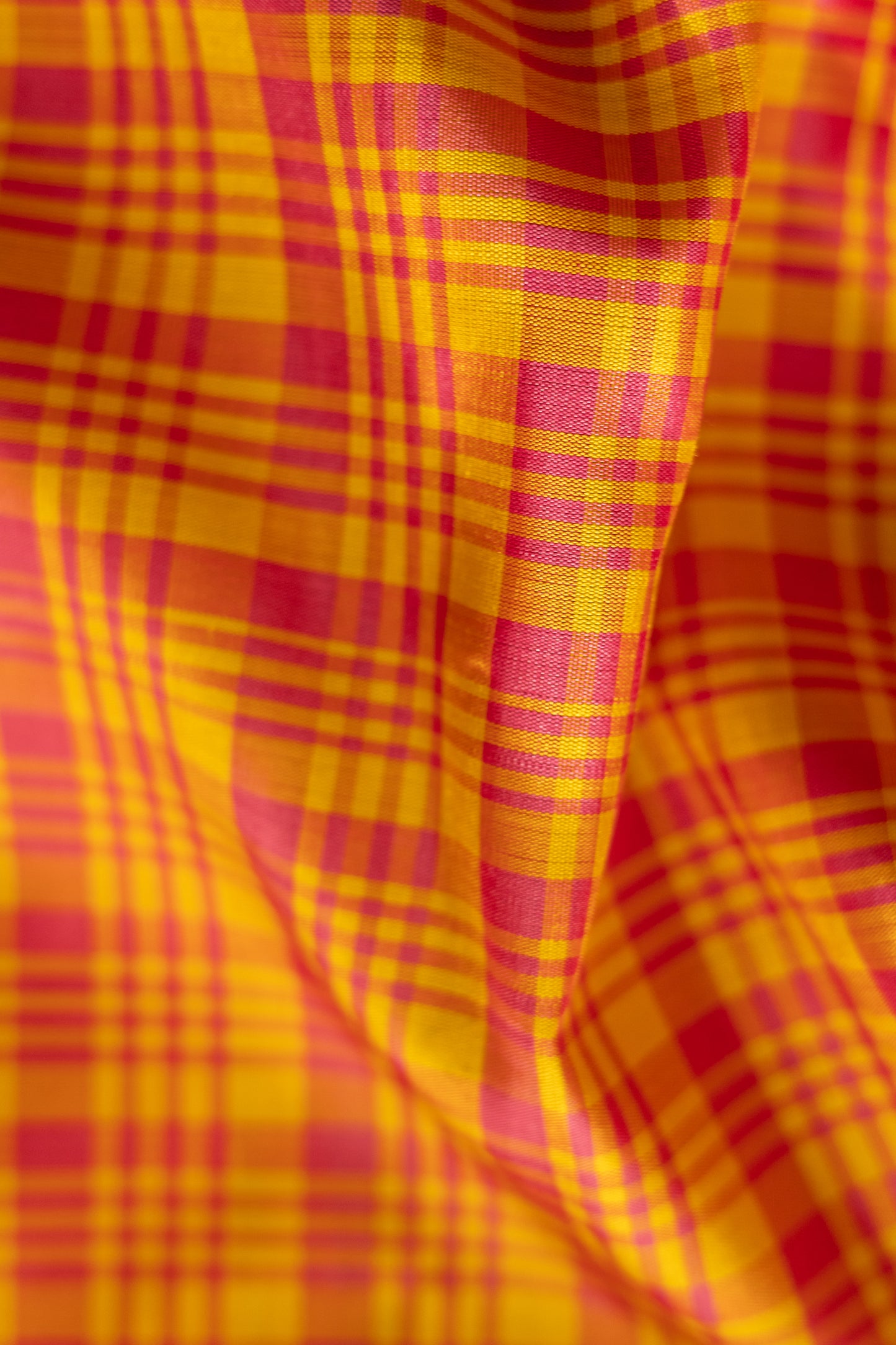 Orange with Pink Checks Kanjivaram Silk Accented by a Purple Pallu Saree