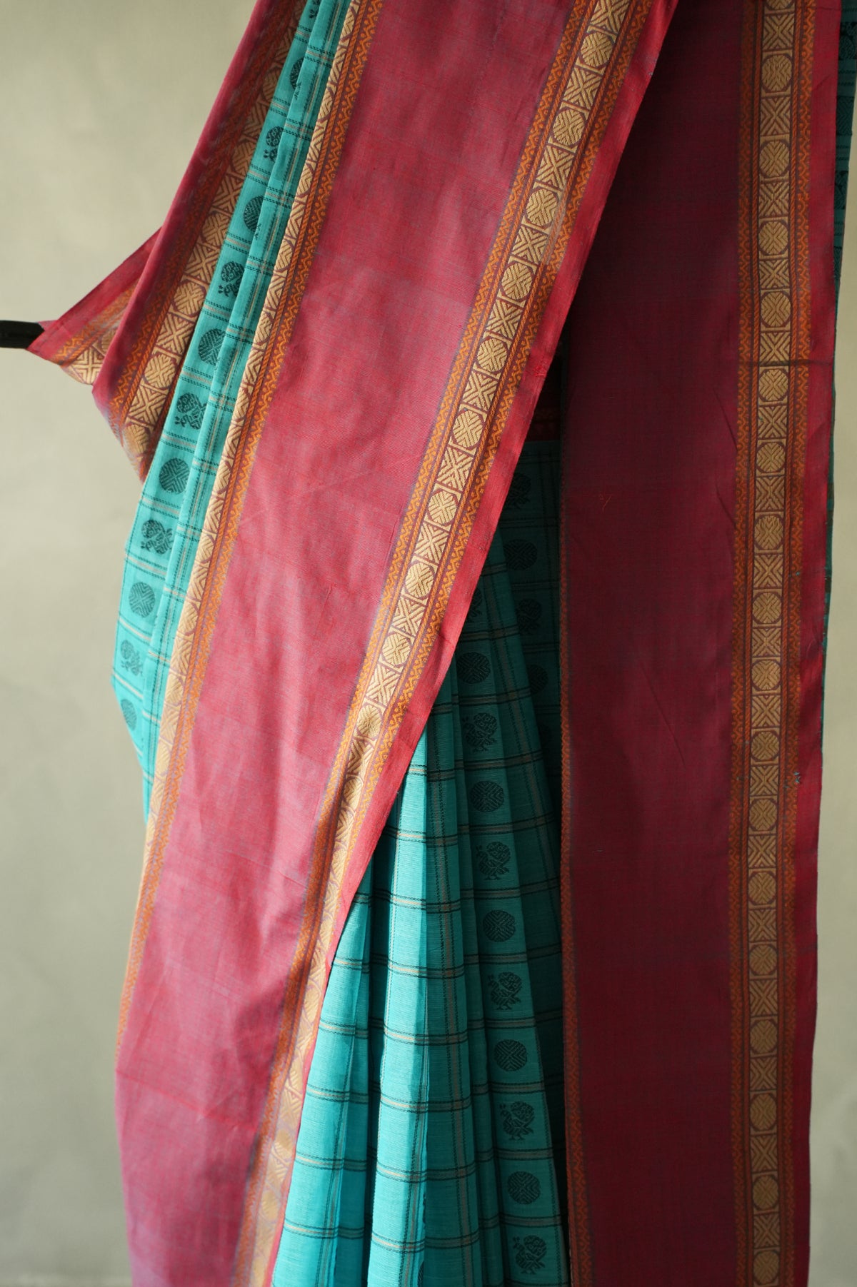 Turquoise Blue Kanchi Cotton Ayiram Butta with Rose Pink Border Saree