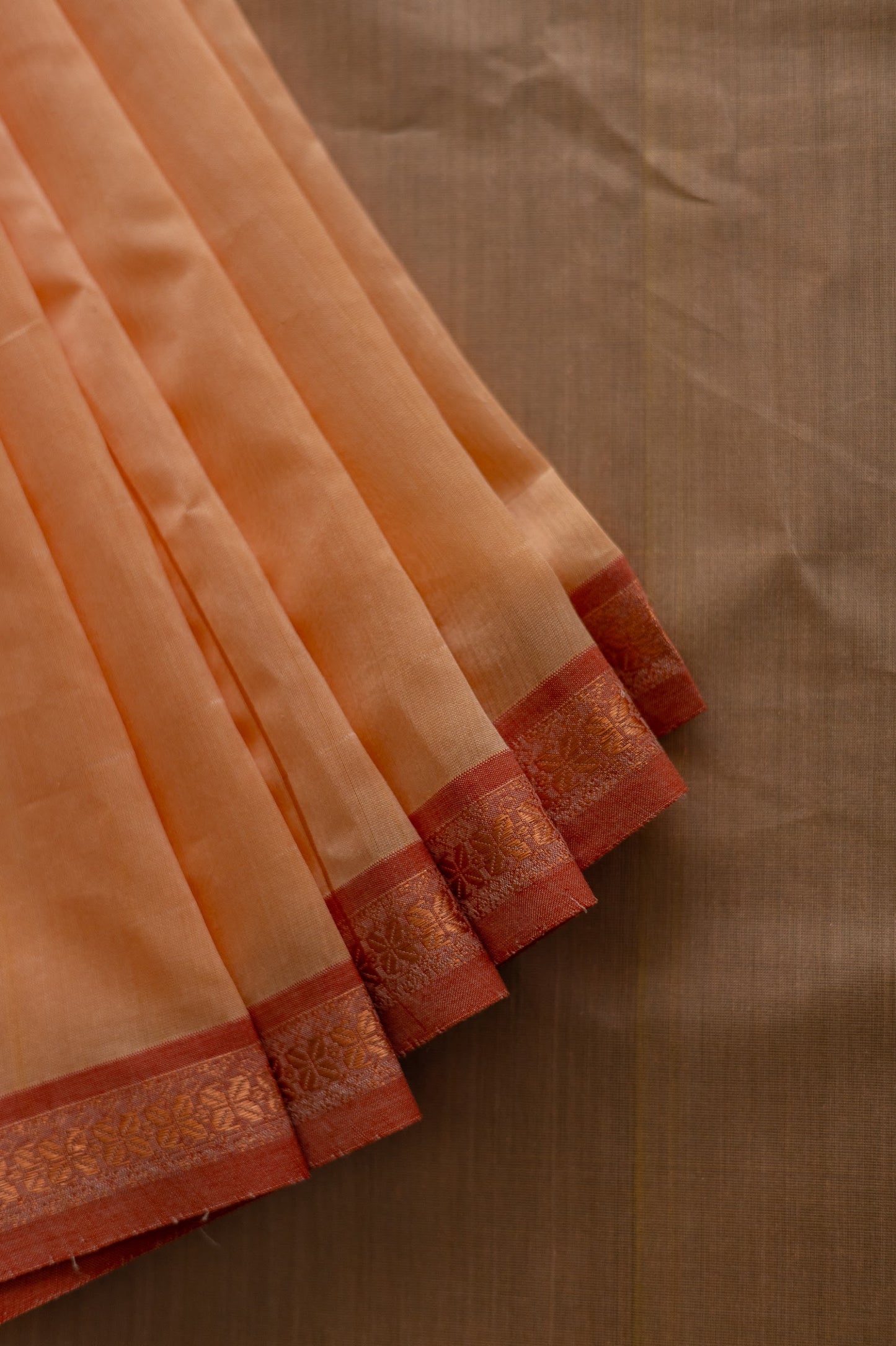 Peach Maheswari Silk Plain Body Stripped Border Saree