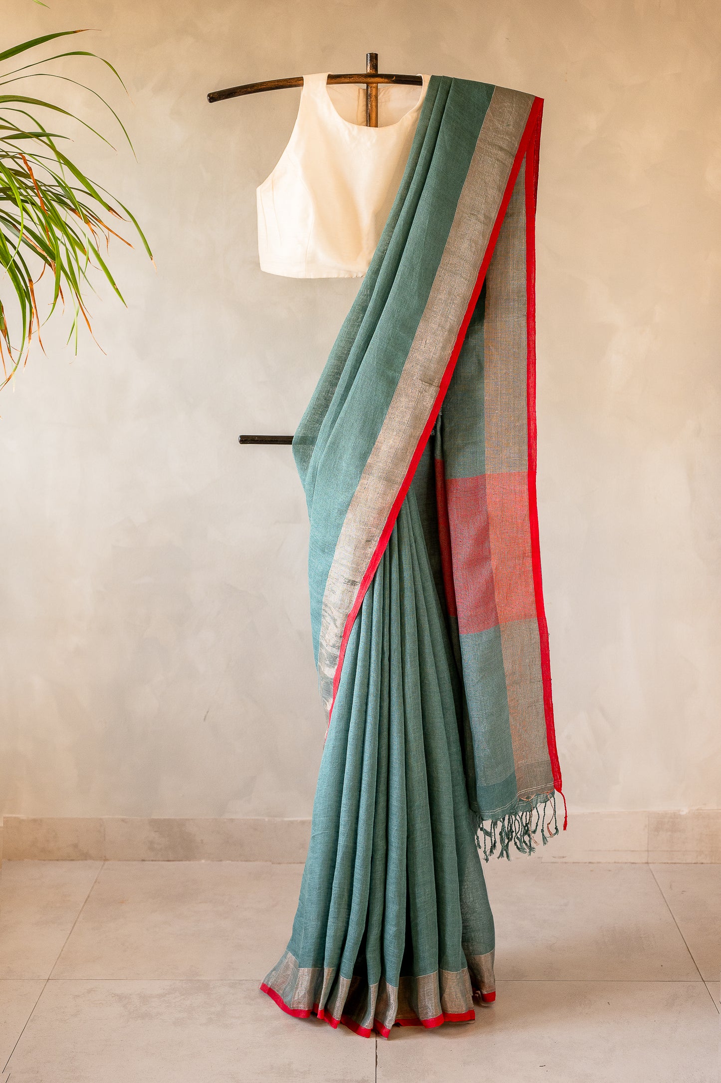 Sage Green Linen Saree with a Vibrant Red Selvedge.