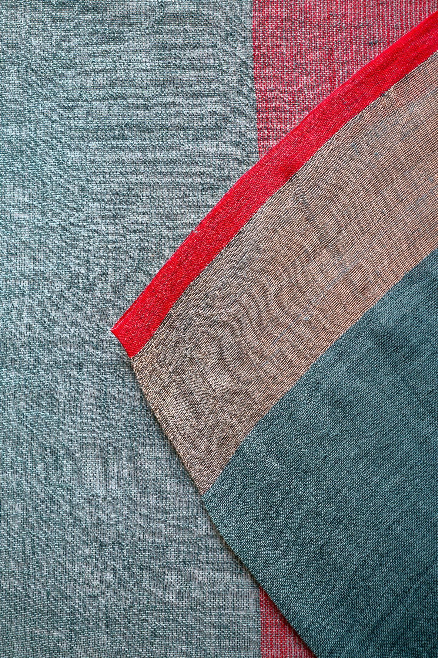 Sage Green Linen Saree with a Vibrant Red Selvedge.