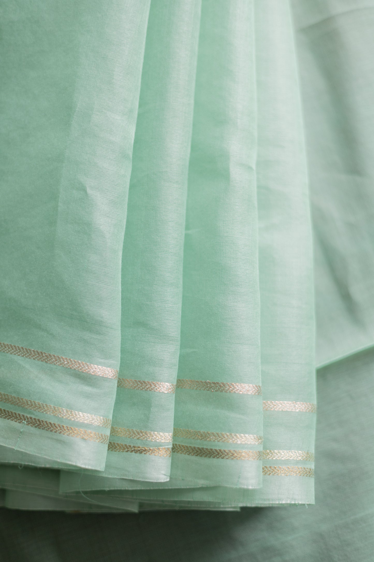 Light Green Silk Cotton with Gold and Silver Border Saree