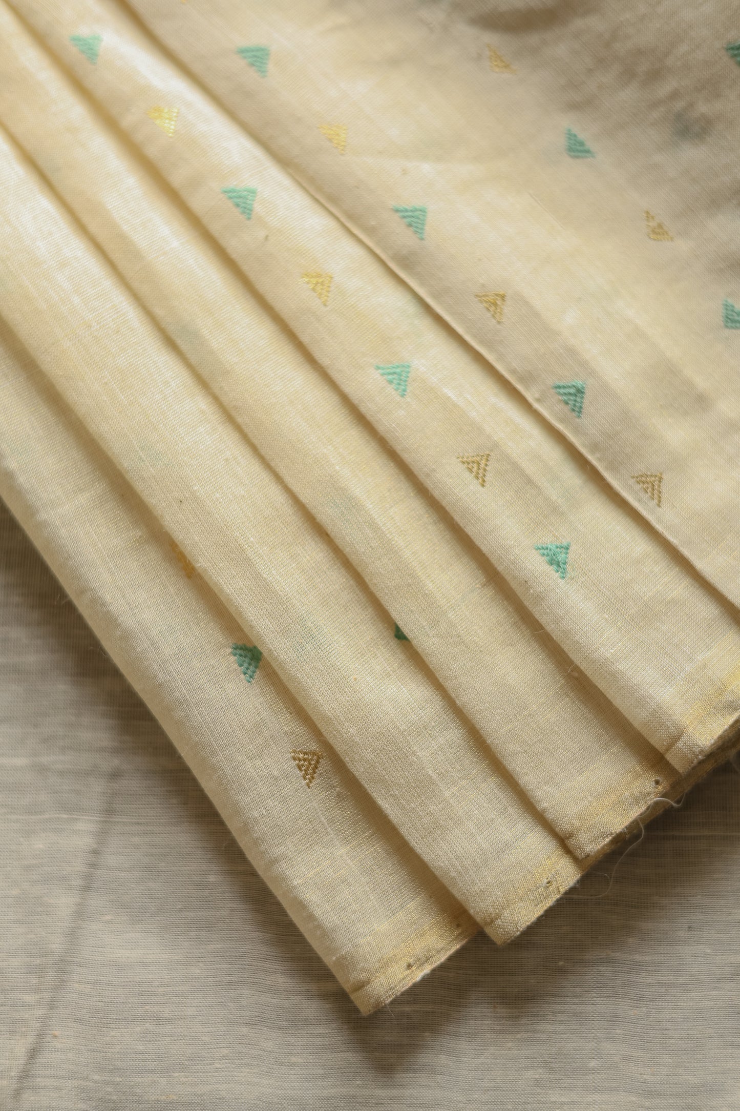 Off White Tussar with Green and Gold Triangle Woven Motif Saree