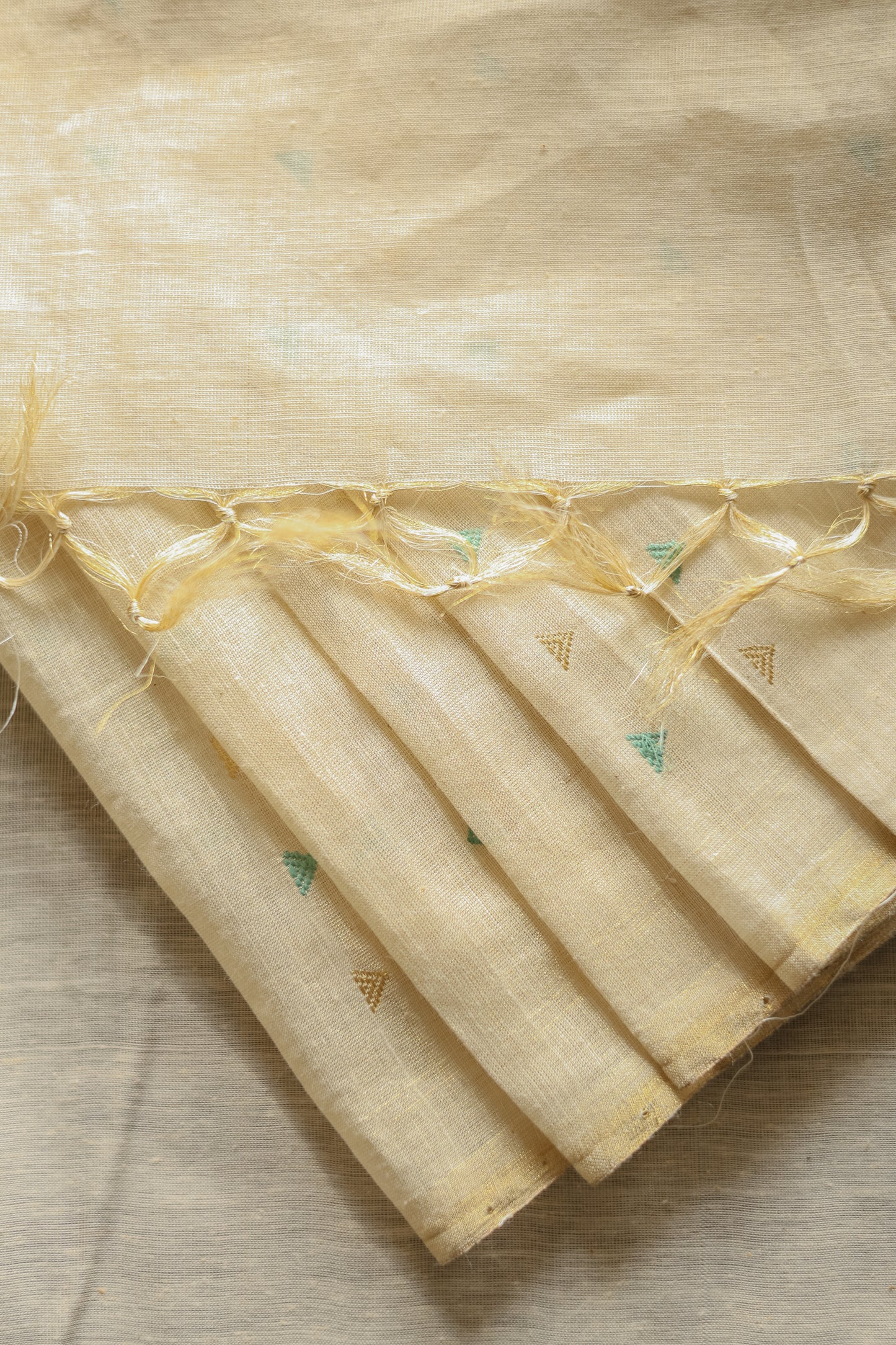 Off White Tussar with Green and Gold Triangle Woven Motif Saree