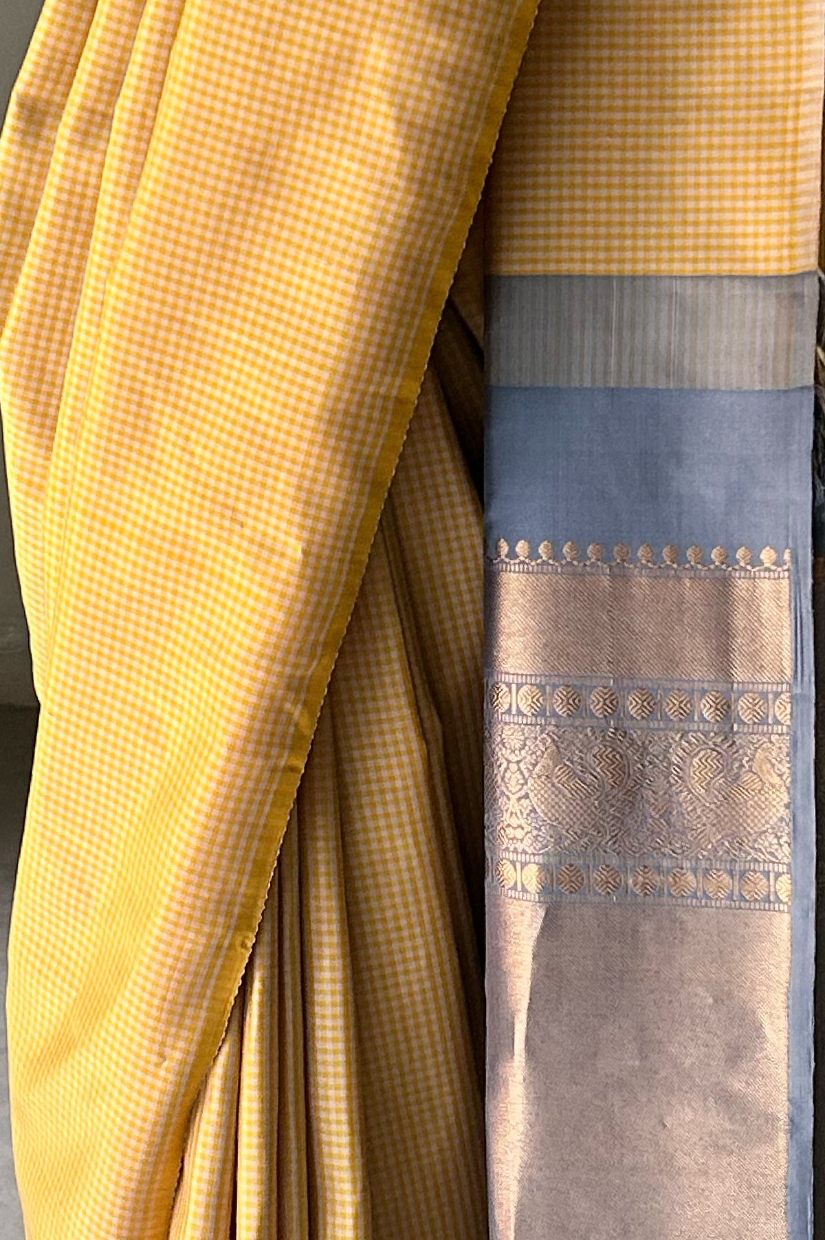 Mustard yellow and off white micro checks sari with grey pallu and blouse