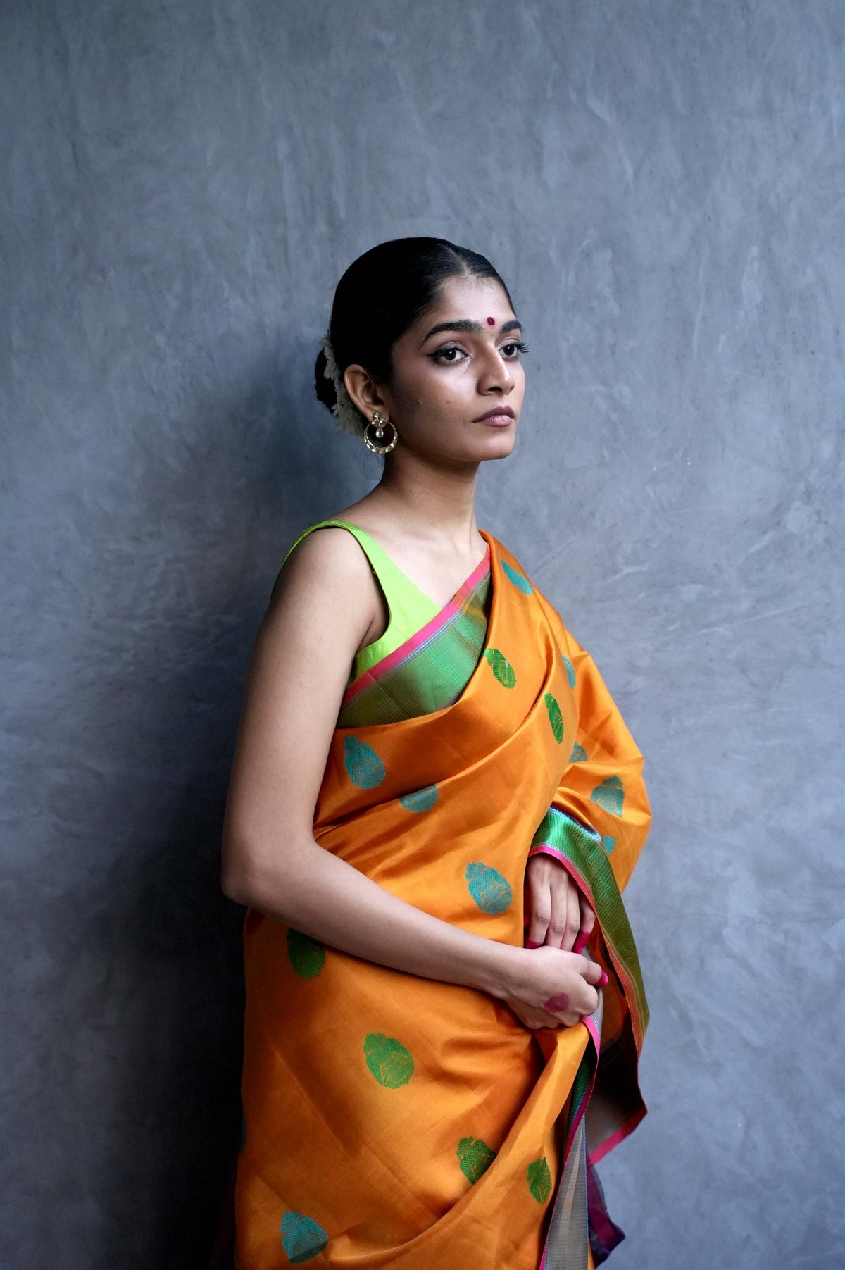 Marigold Orange Kanjivaram Silk Saree with Turquoise and Green Buttas and Contrast Green Border