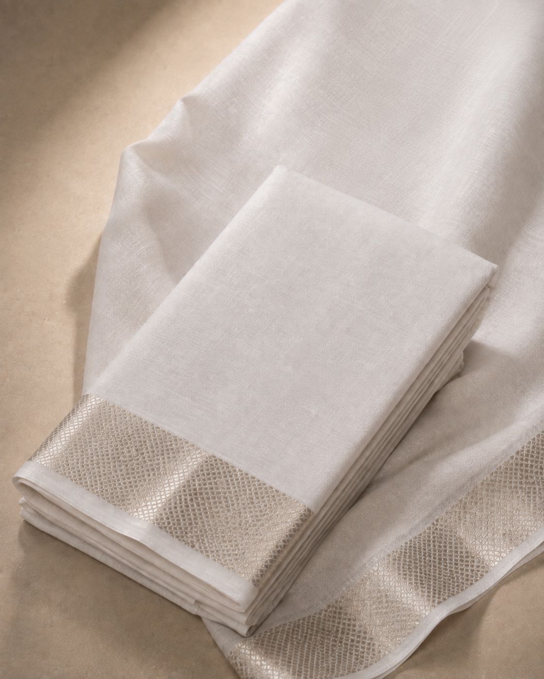 White Kanjivaram Silk Veshti with Silver Zari Kan Pettu Border